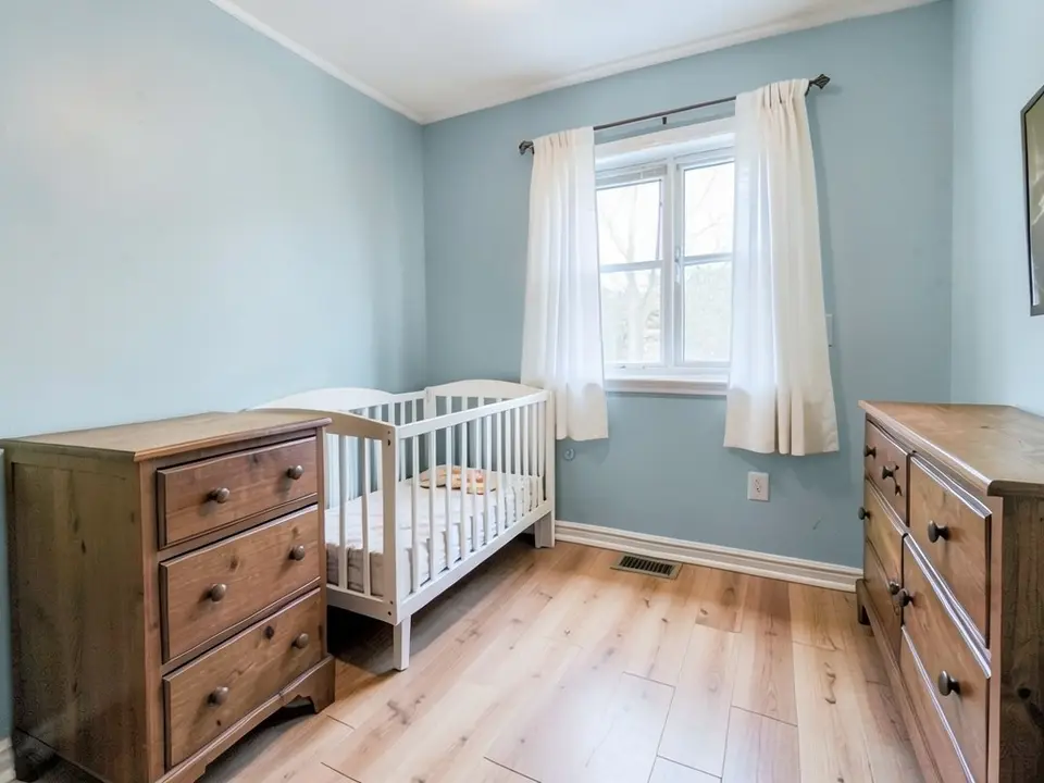 The same room with the walls painted a soft pale blue-gray